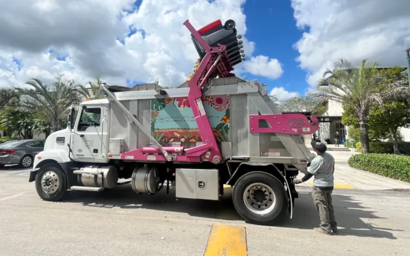 A Fertile Earth collection truck lifting a food-scrap toter