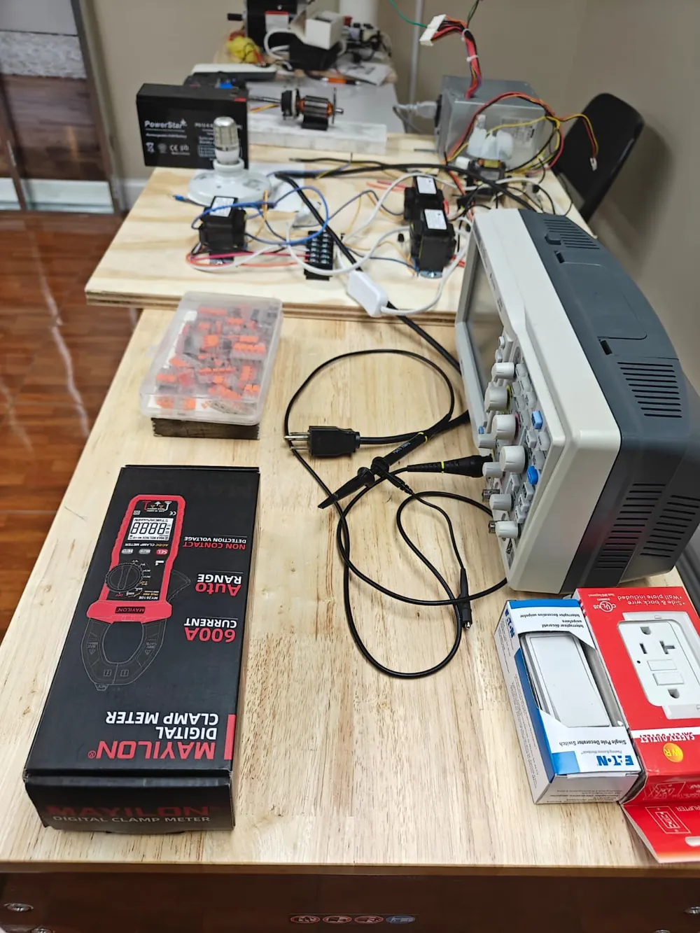 Digital multimeter, oscilloscope and wiring on a lab workbench at Florida Professional Institute