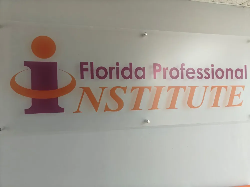 The Florida Professional Institute logo sign on the lobby wall