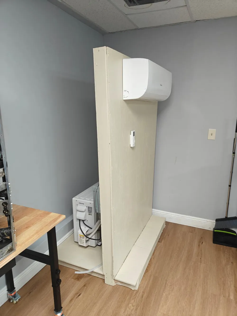 Ductless mini-split air conditioner mounted on a training wall in the air conditioning lab
